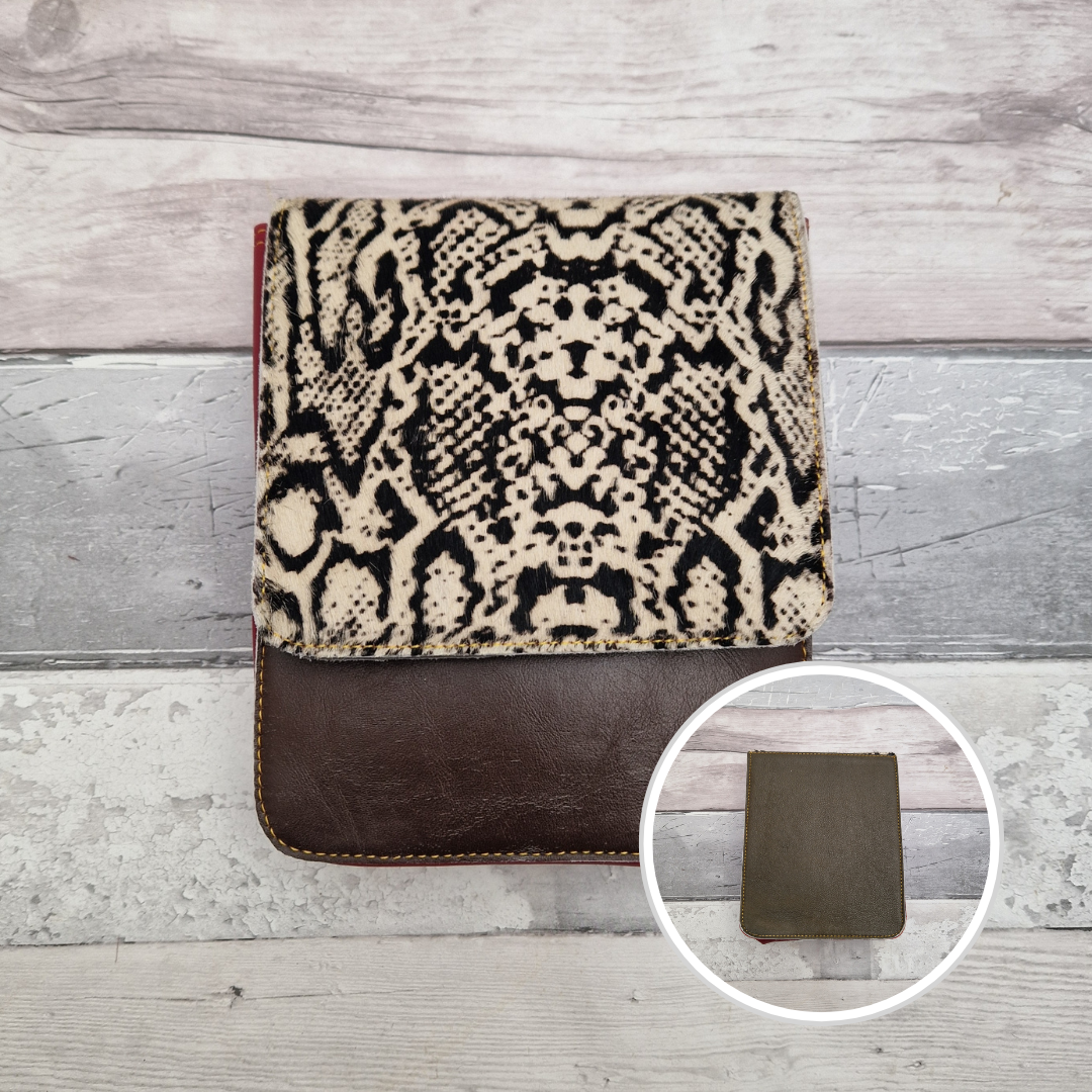 Dark brown leather bag with a black and white snake skin panel.