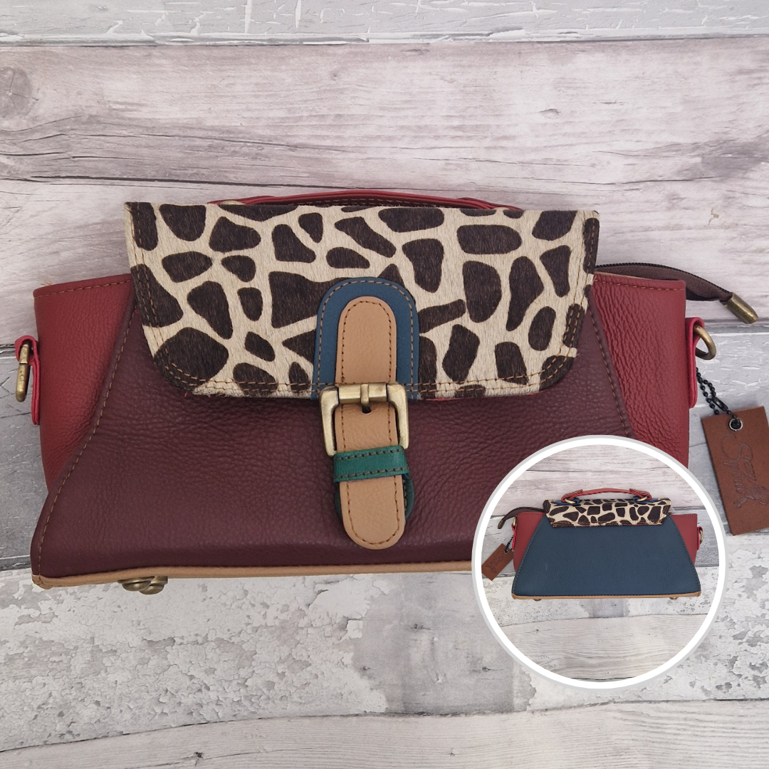 Mini satchel style ladies all leather handbag. Mixed burgundy and red colours with a textured giraffe print panel.