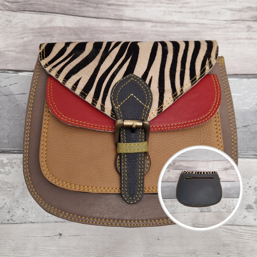 Saddlebag style bag in mocha moose coloured leather with contrasting coloured panels and a section of textured zebra print
