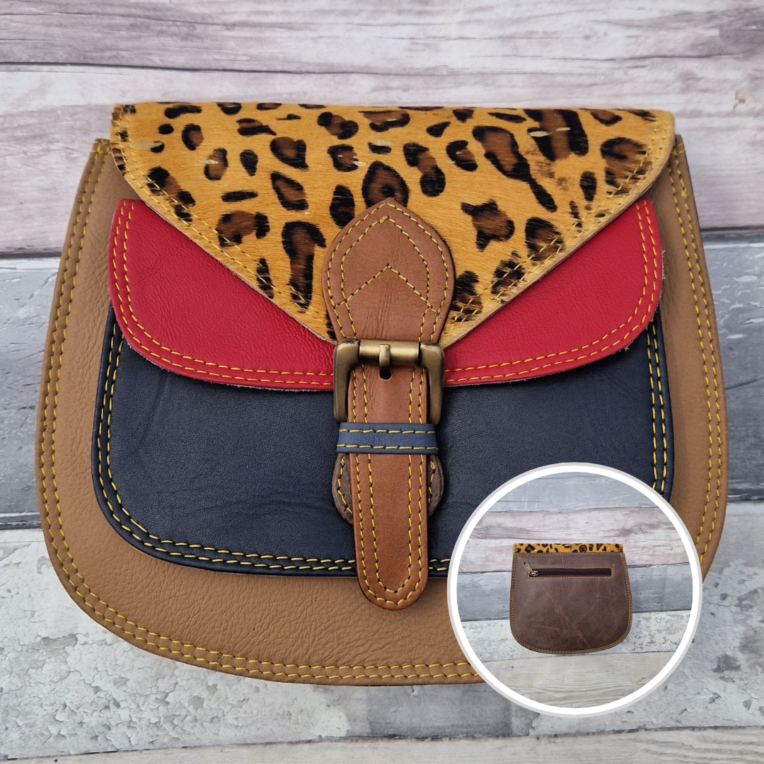 Saddlebag style bag in tan leather with contrasting coloured panels and a section of textured metallic leopard print.