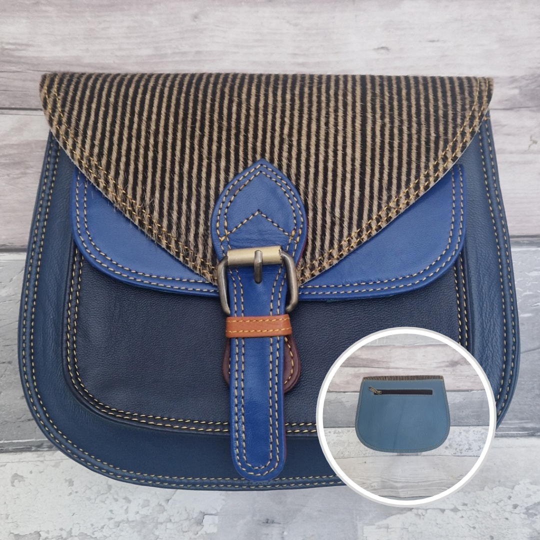 Saddlebag style bag in blue coloured leather with contrasting coloured panels and a section of textured stripe Print