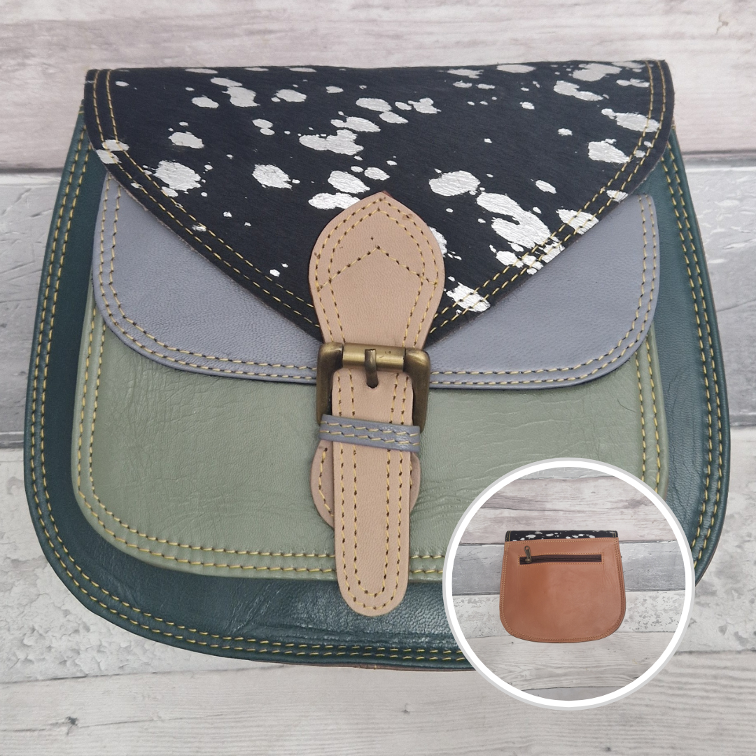 Saddlebag style bag in green coloured leather with contrasting coloured panels and a section of textured metallic pony print