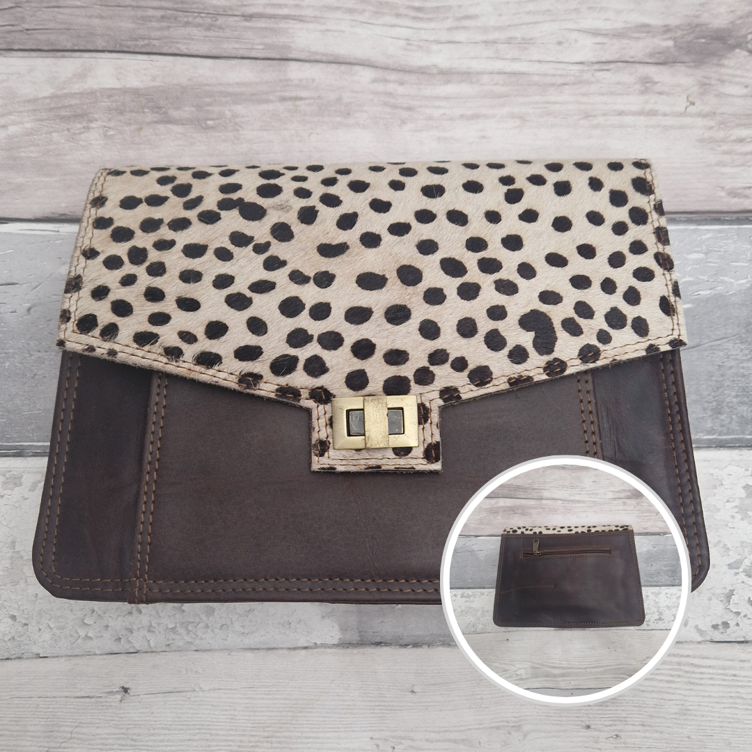 Spot print clutch bag with a close-up inset on a wooden surface