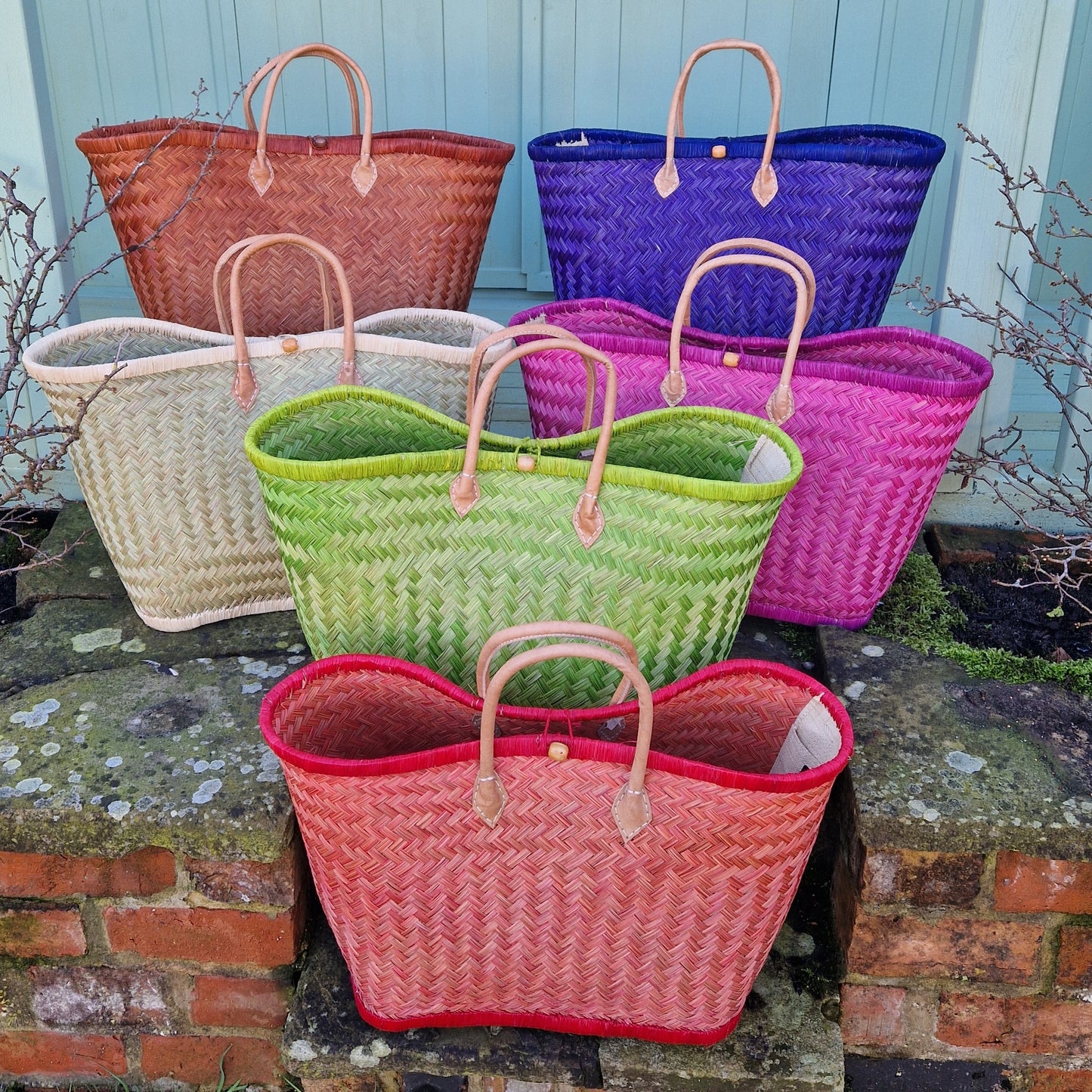 Group of 6 colourful woven French basket baskets.
