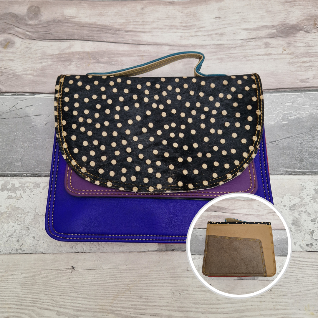 All leather bag with top handle and detachable crossbody strap. Bright Blue leather with a striking textured panel of spot print.