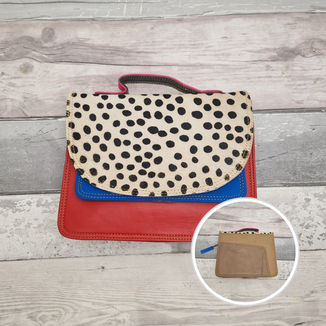 All leather bag with top handle and detachable crossbody strap. Red leather with a striking textured panel of spot print.