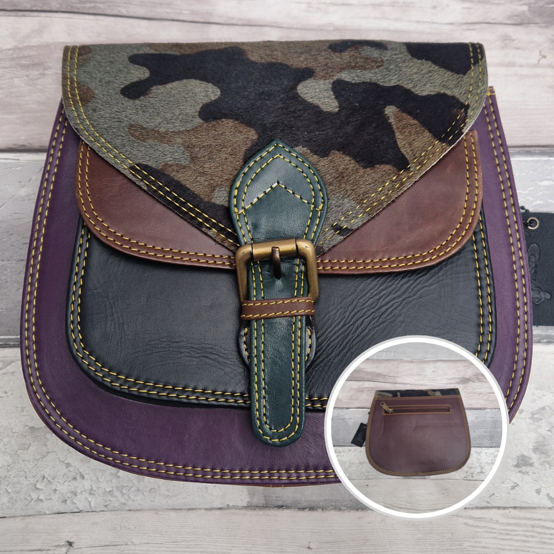 Saddlebag style bag in purple coloured leather with contrasting coloured panels and a section of textured camo print.