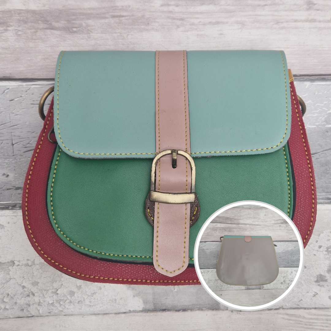 All leather saddlebag style ladies bag in 3 colours of red, green and aqua mint. Brass buckle closer.