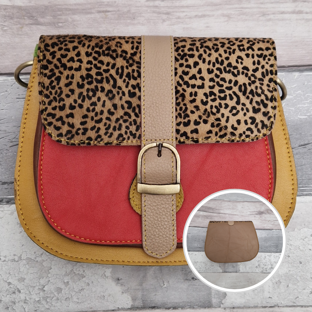 All leather saddlebag style ladies bag in 2 tones of mustard and red with a textured panel of cheetah print. Brass buckle closer.
