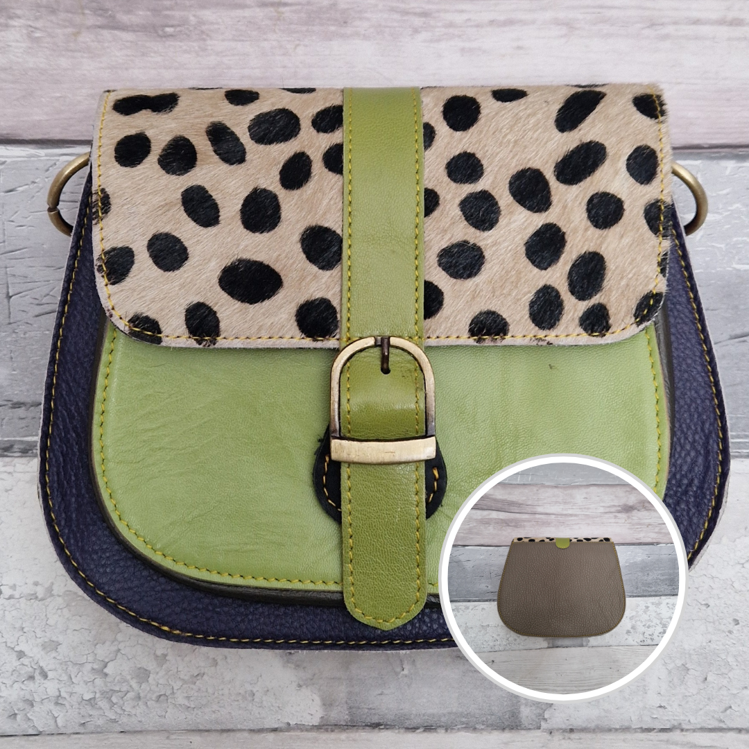All leather saddlebag style ladies bag in 2 tones of navy and lime with a textured panel of spot print. Brass buckle closer.