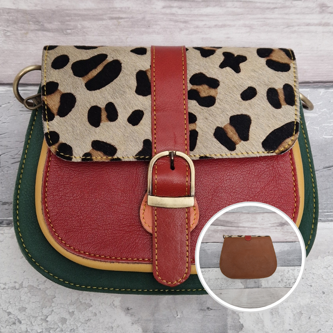 All leather saddlebag style ladies bag in 2 tones of red and green with a textured panel of leopard print. Brass buckle closer.