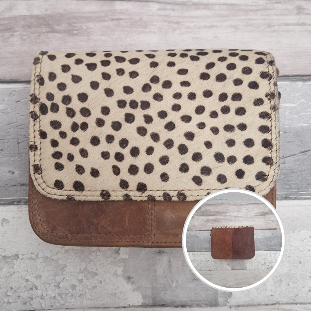 Leather bag with a textured flap of spot print.