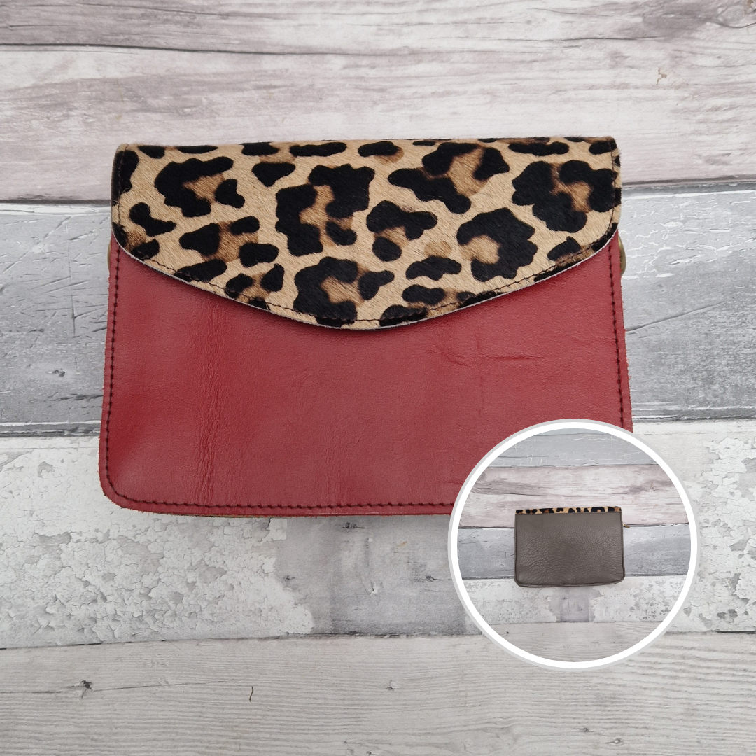 Leather handbag with a red front and a panel of textured Jaguar animal print.