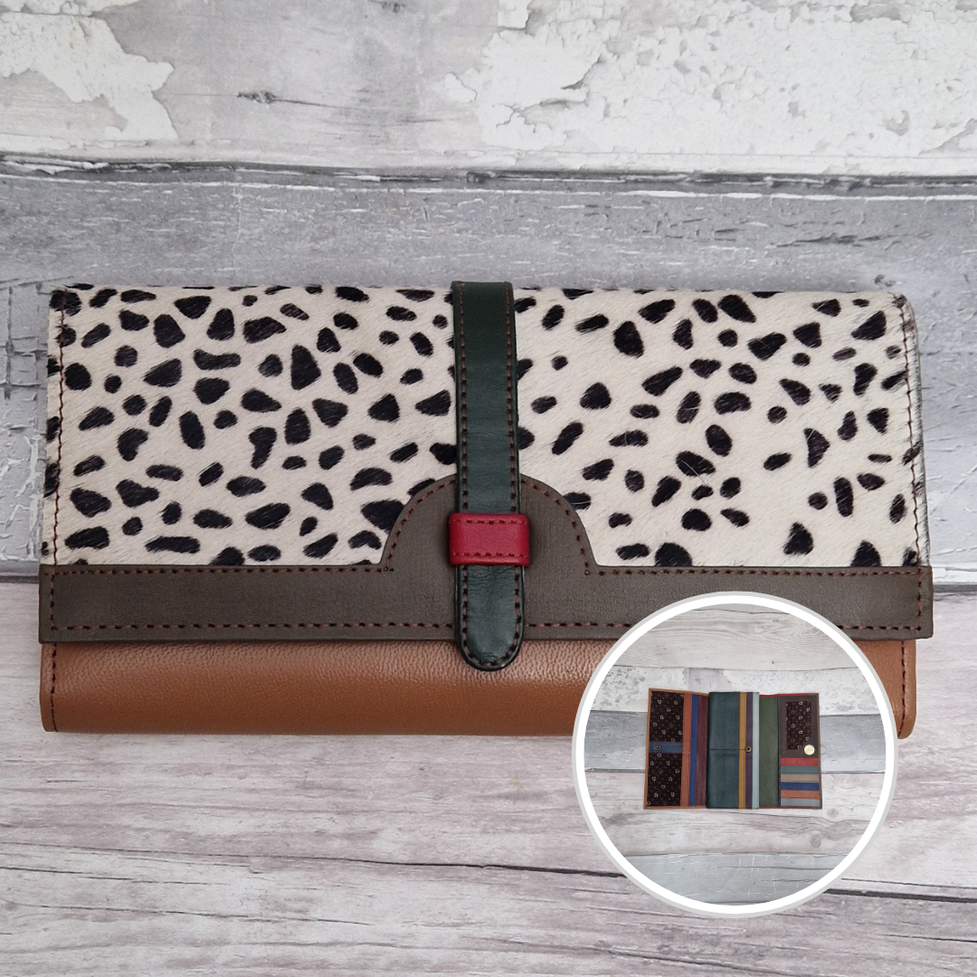All leather fold out purse made from a mix of colours with a textured front panel of spot print.