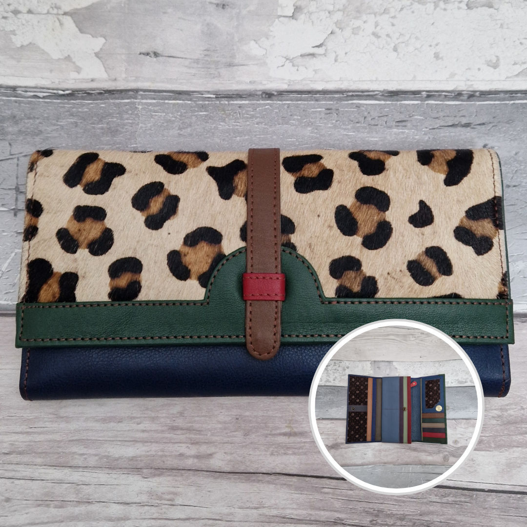 All leather fold out purse made from a rainbow of colours with a textured front panel of leopard print.