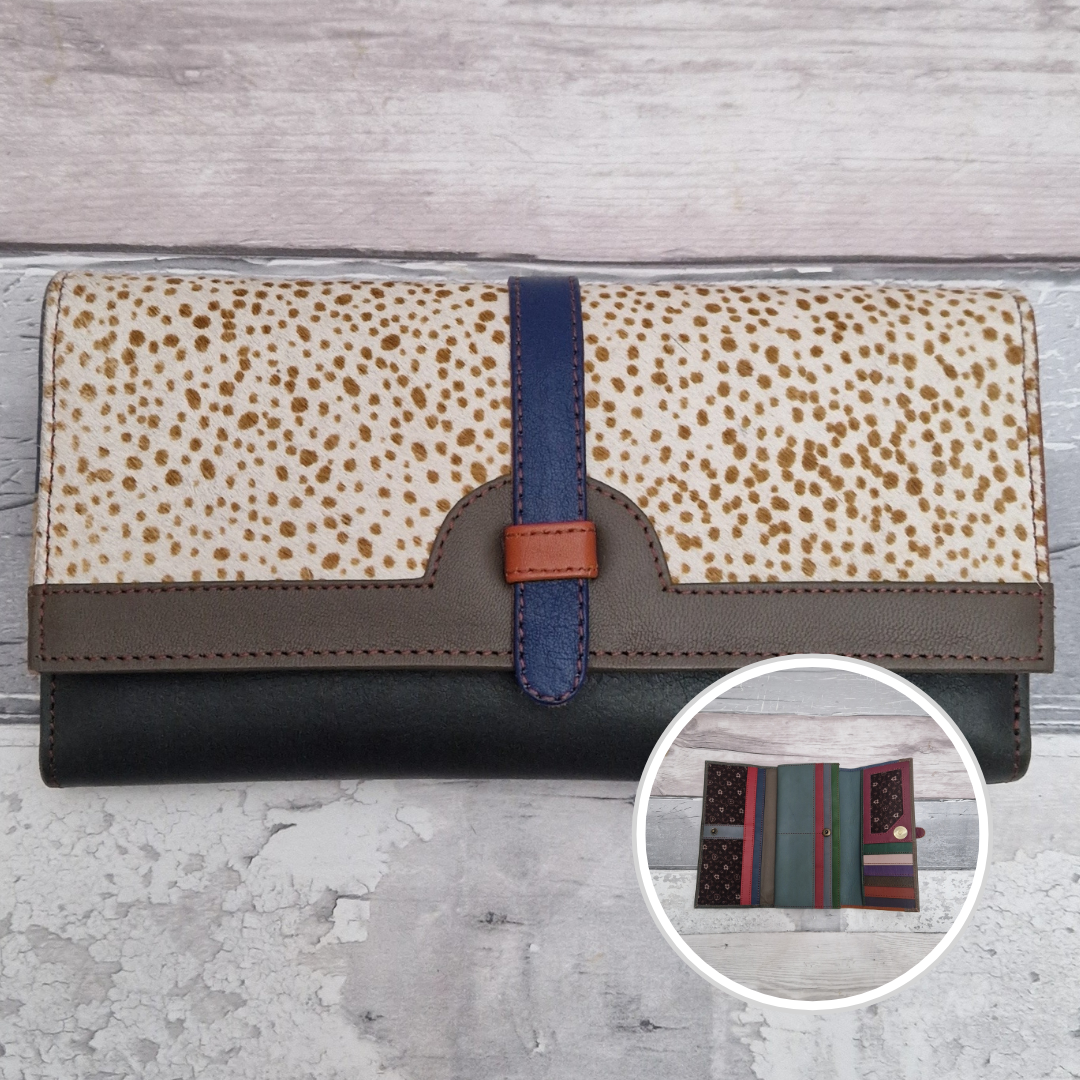 All leather fold out purse made from a rainbow of colours with a textured front panel of spot print.