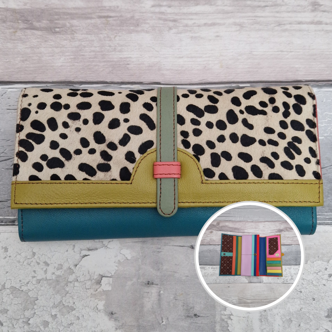 All leather fold out purse made from a rainbow of colours with a textured front panel of spot print.