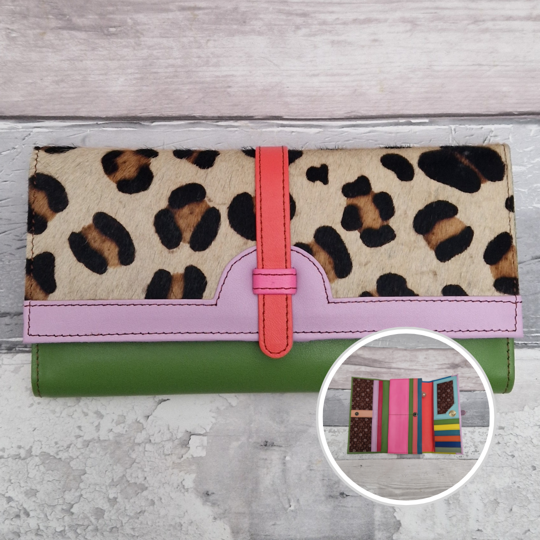 All leather fold out purse made from a rainbow of colours with a textured front panel of leopard print.
