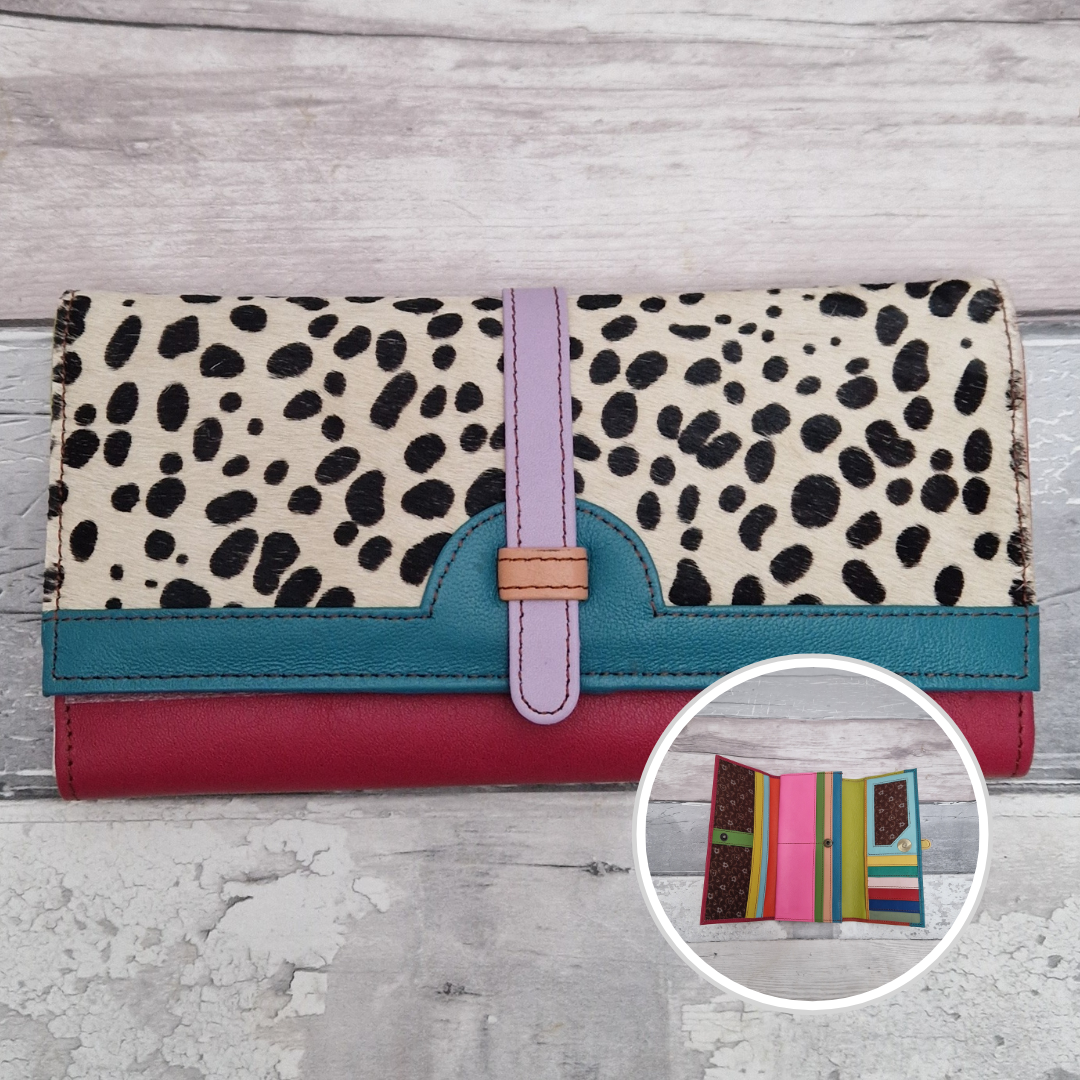 All leather fold out purse made from a rainbow of colours with a textured front panel of spot print.