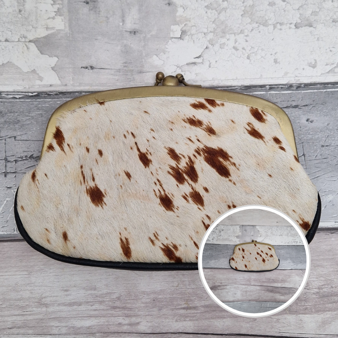 Hair on brown and white pony print leather clutch bag.