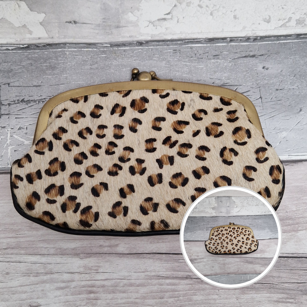 Leopard print clutch bag on a wooden surface with a close-up inset.