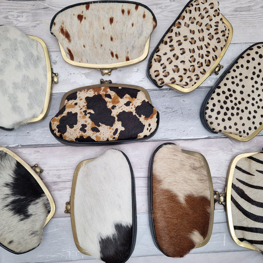 Group of animal print leather clutch bags 