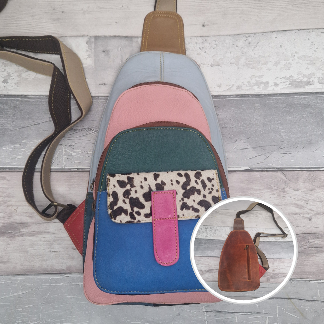 Multicolored all leather sling bag with cow print pocket.