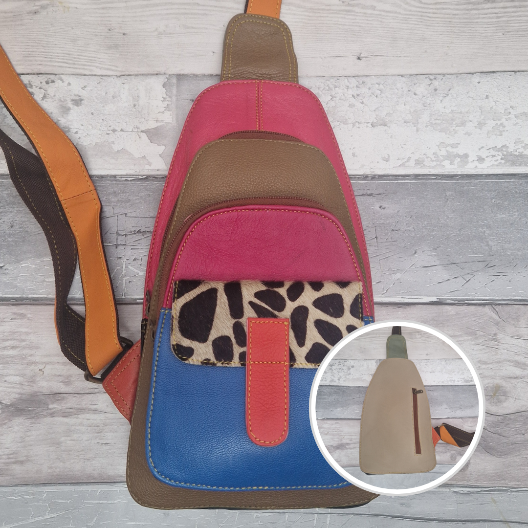 Multicolored all leather sling bag with giraffe print pocket.