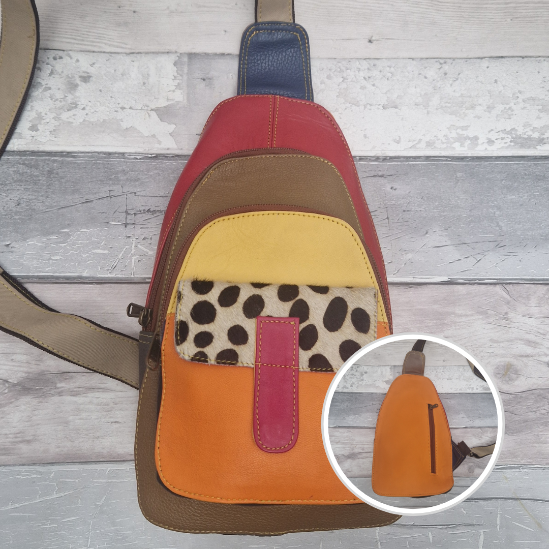 Multicolored all leather sling bag with spot print pocket.