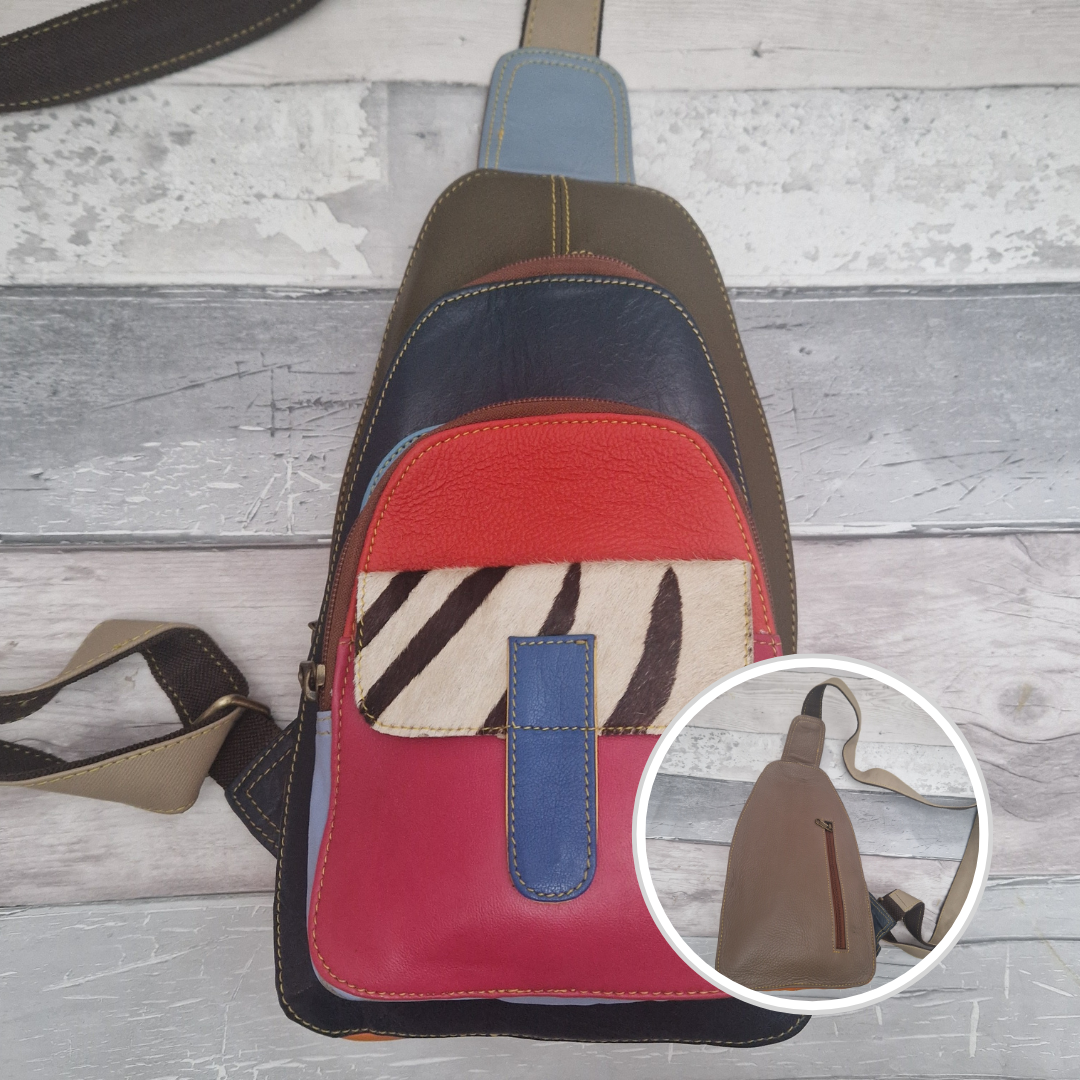 Multicolored all leather sling bag with zebra print pocket.