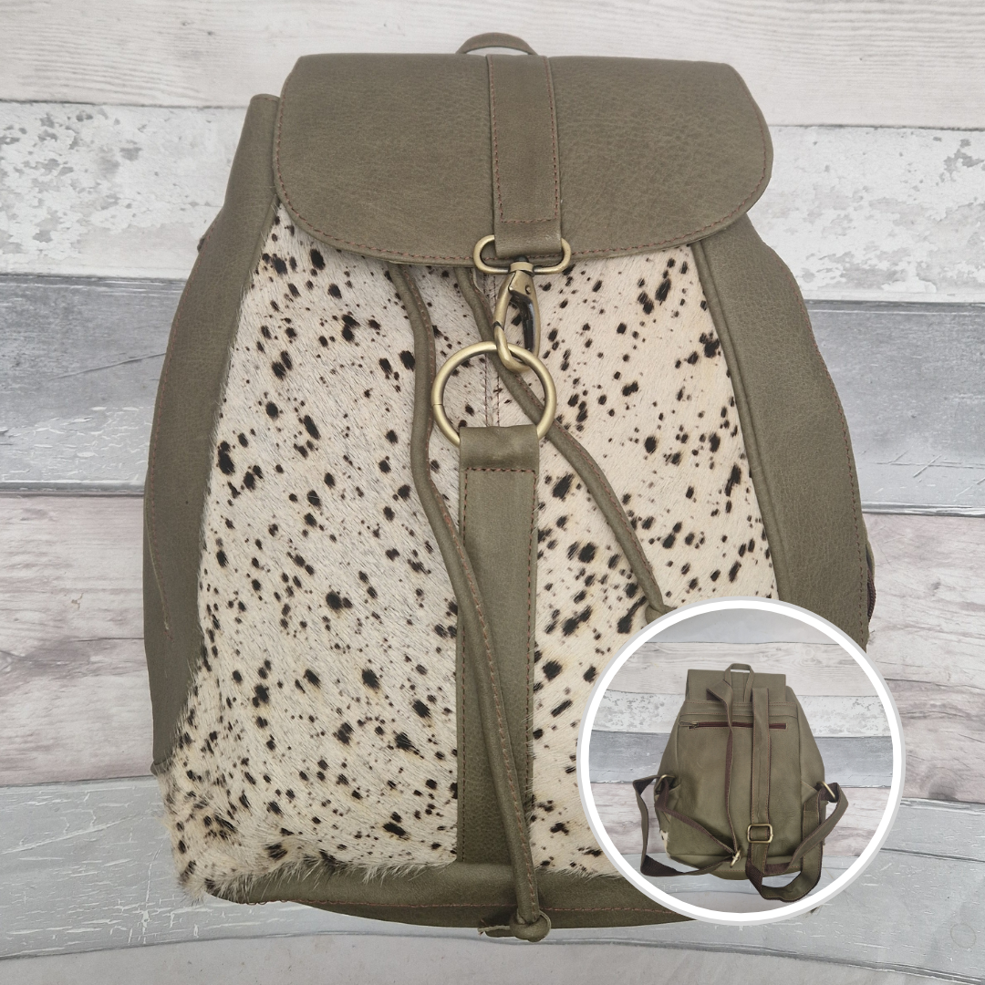 Green backpack with spotted pattern on a wooden surface