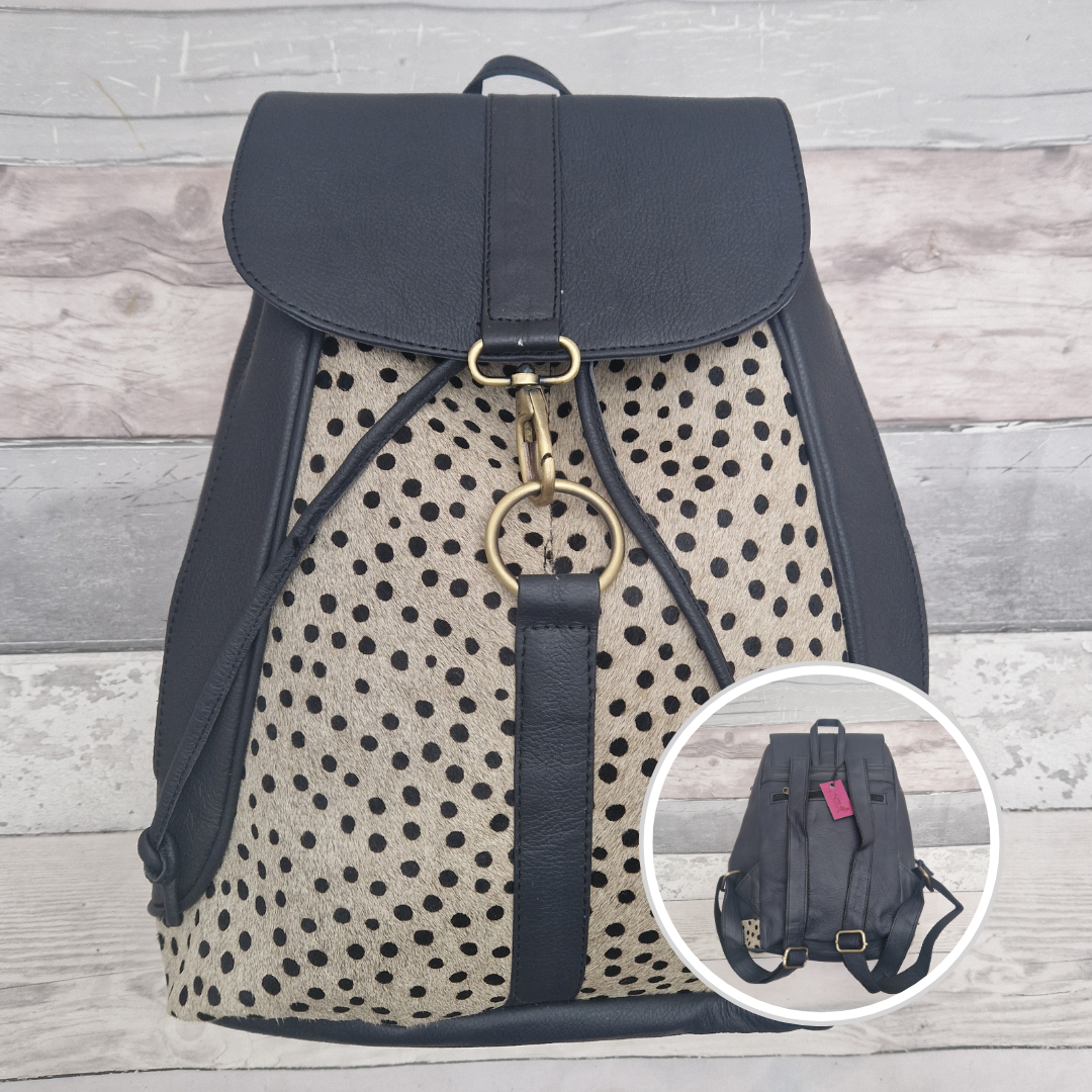 Dark Navy all leather back pack with textured panels of a spotty print.