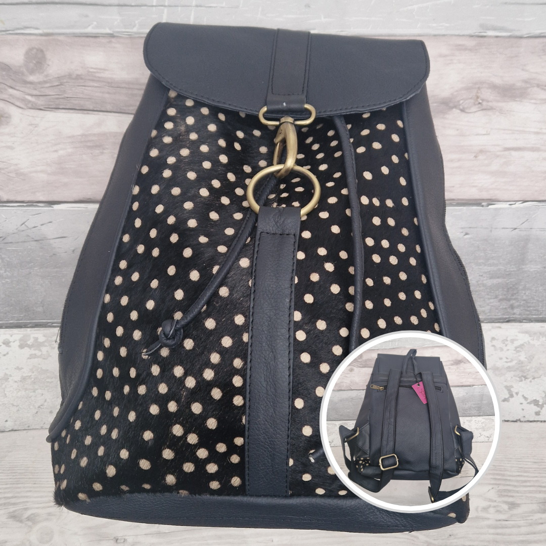 Dark Navy all leather back pack with textured panels of a spotty print.