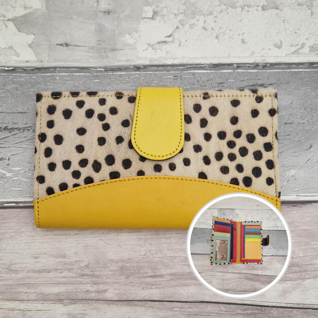 All leather wallet style purse made from multi-coloured pieces with a yellow front panel and textured spot print cover.