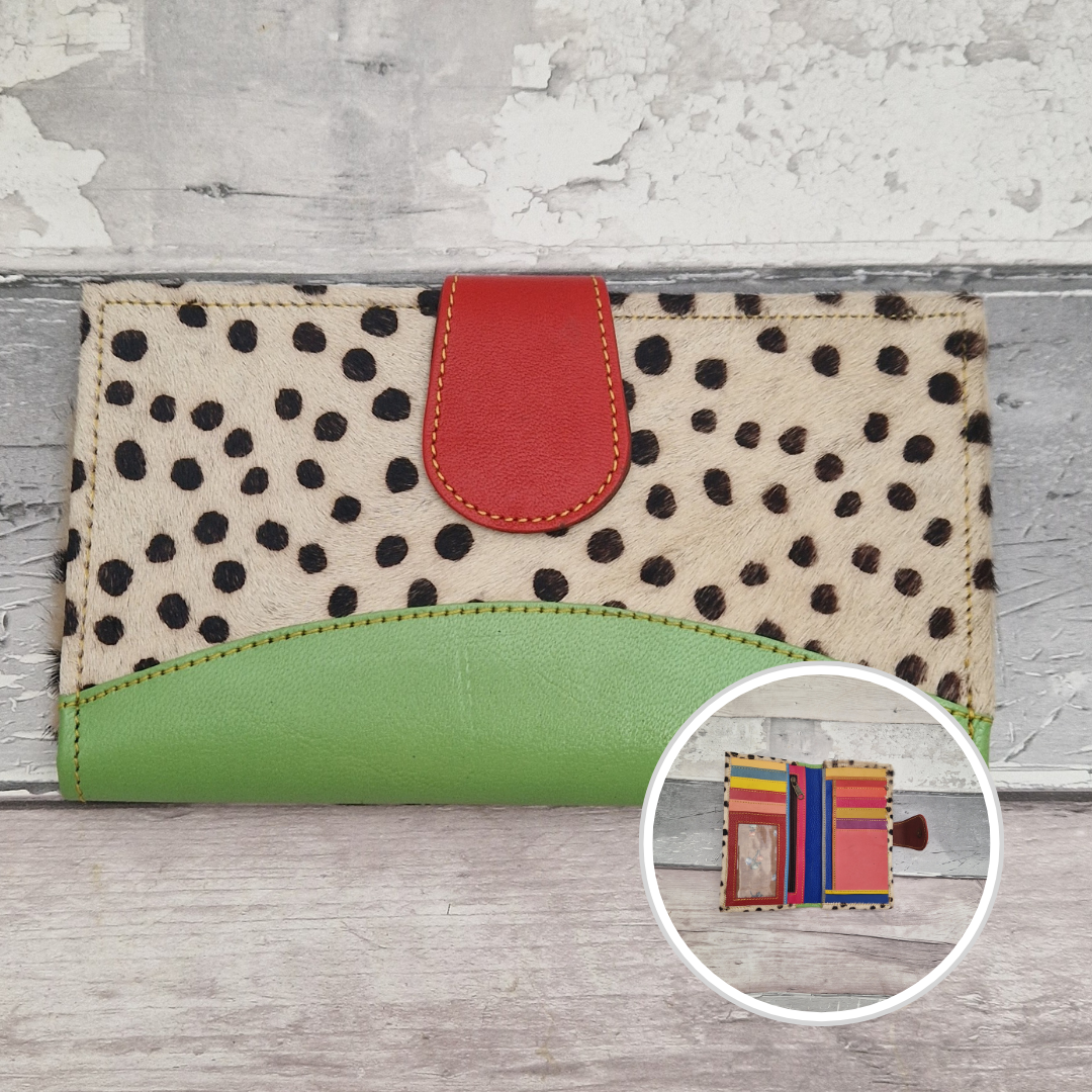 All leather wallet style purse made from multi-coloured pieces with a green front panel and textured spot print cover.