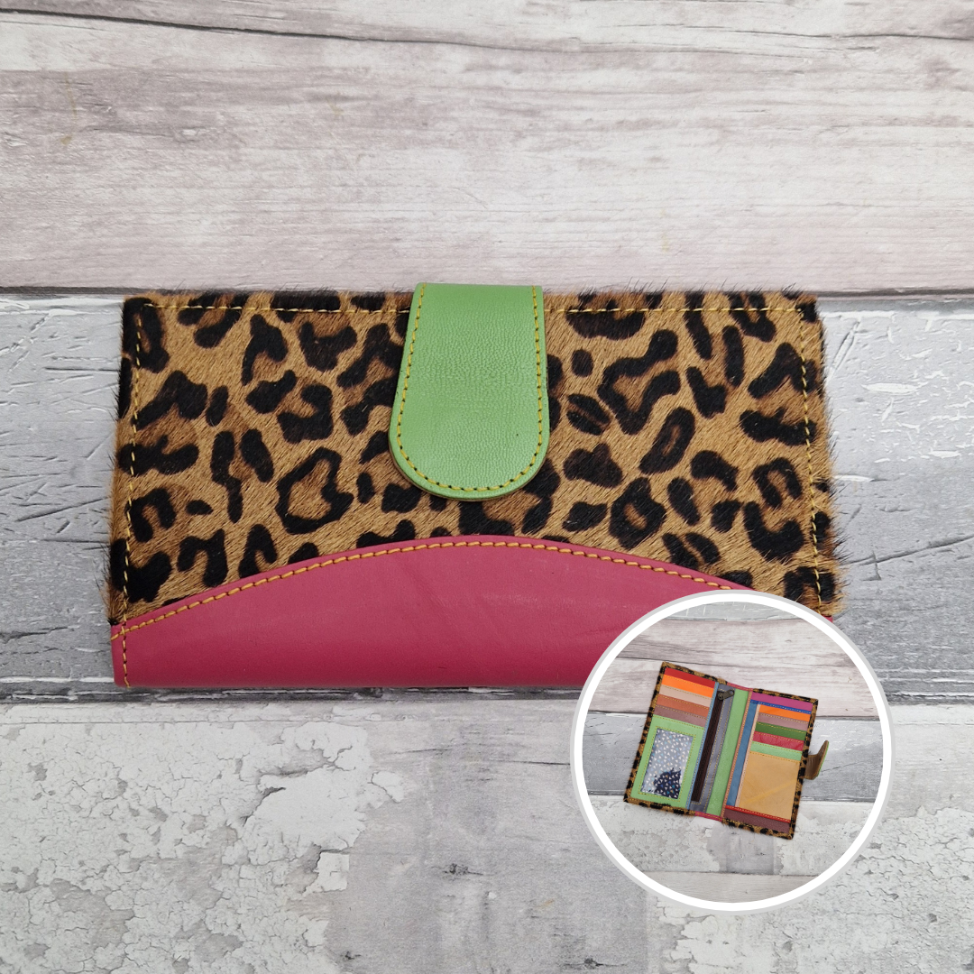 All leather wallet style purse made from multi-coloured pieces with a Hot Pink front panel and textured jaguar print cover.