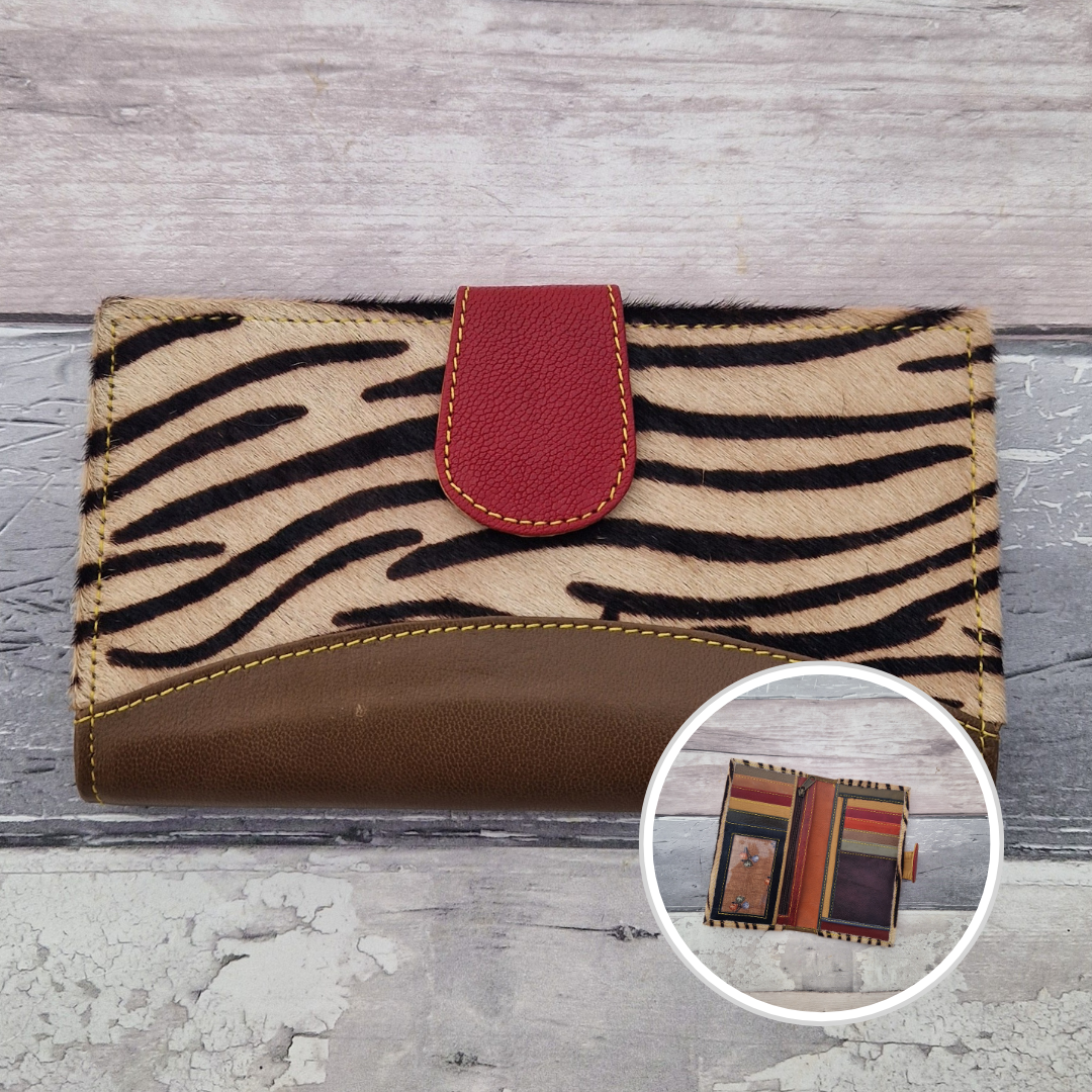 All leather wallet style purse made from multi-coloured pieces with a brown front panel and textured zebra print cover.