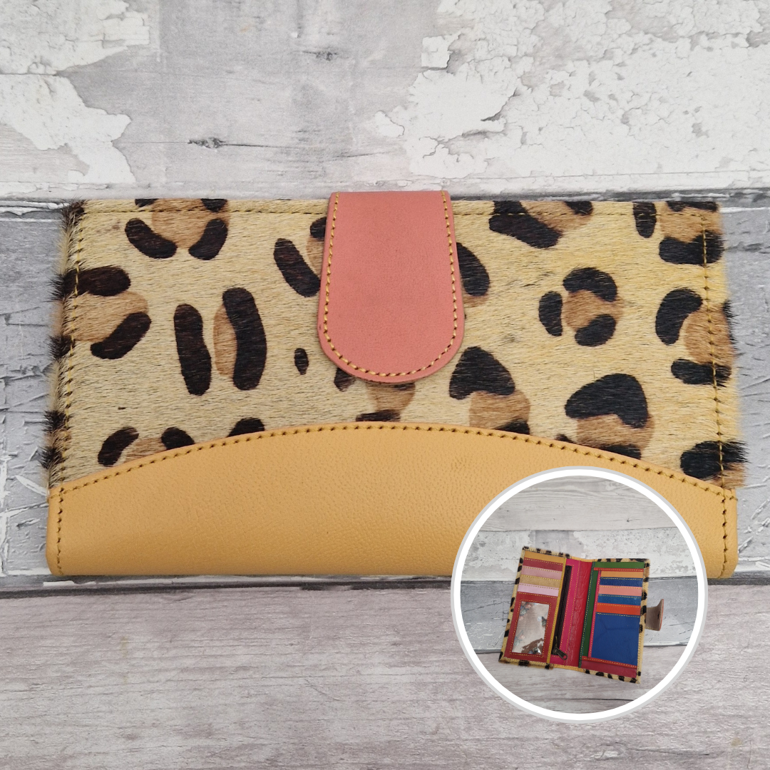 All leather wallet style purse made from multi-coloured pieces with a yellow front panel and textured large leopard print cover.