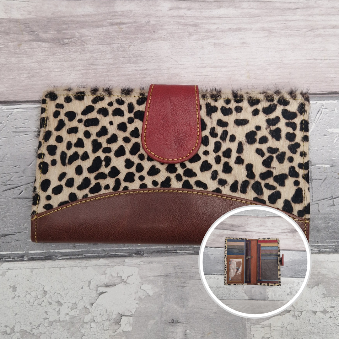 All leather wallet style purse made from multi-coloured pieces with a brown front panel and textured lynx print cover.