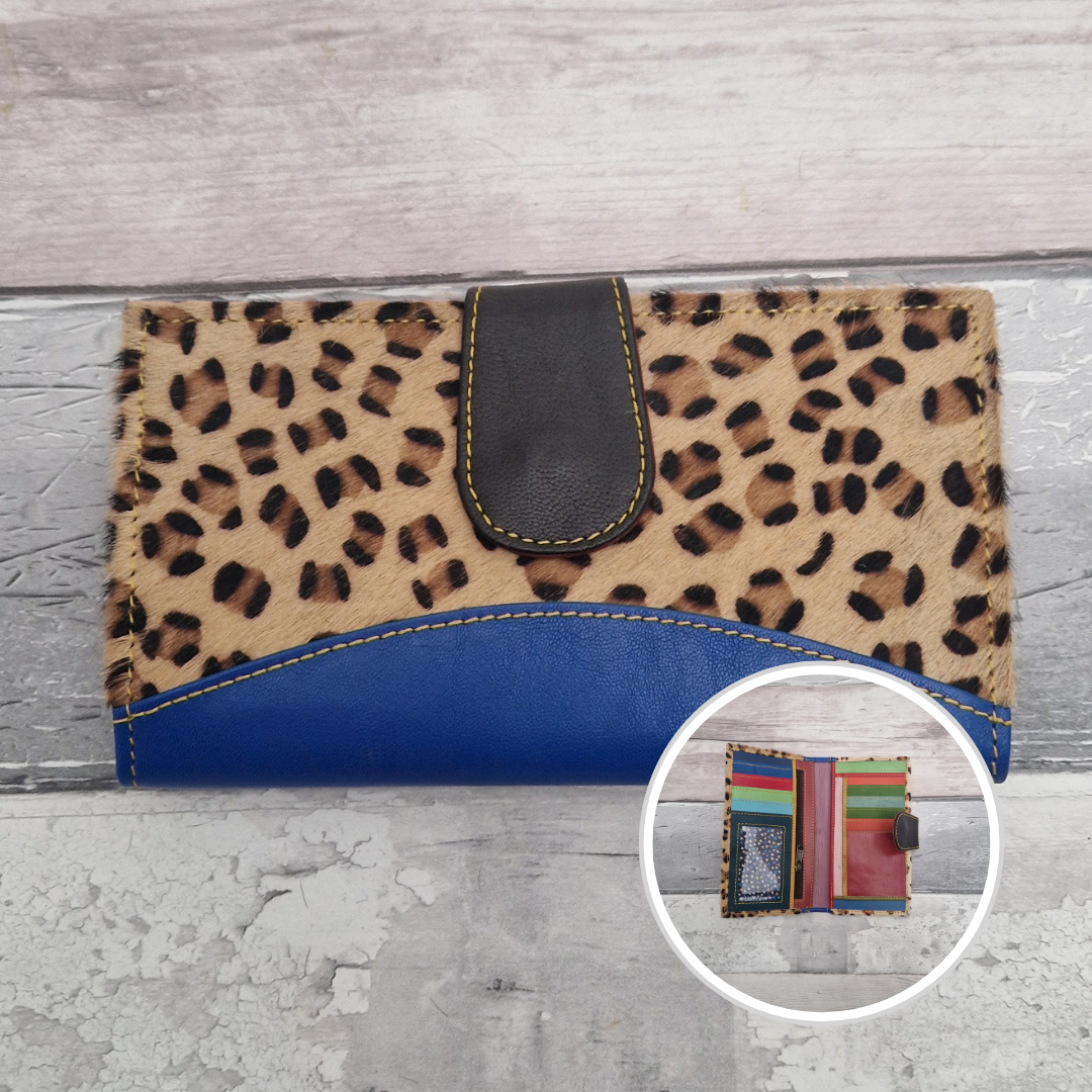 All leather wallet style purse made from multi-coloured pieces with a bright blue front panel and textured leopard print cover.