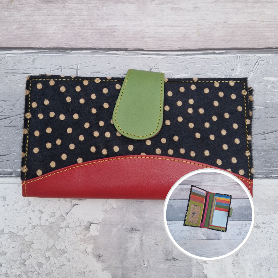 All leather wallet style purse made from multi-coloured pieces with a red front panel and textured spot print cover.