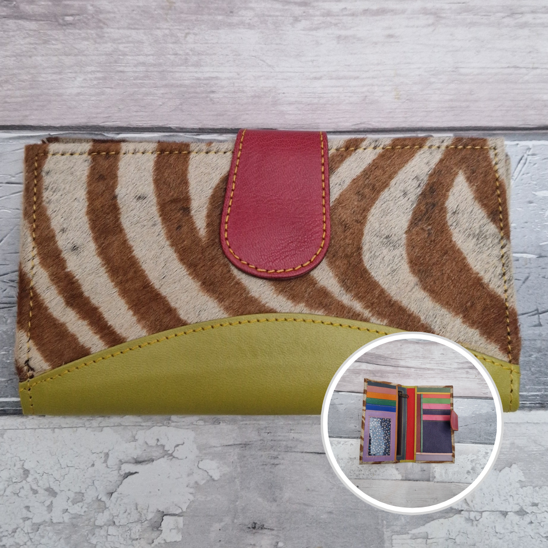 All leather wallet style purse made from multi-coloured pieces with a lime green front panel and textured zebra print cover.