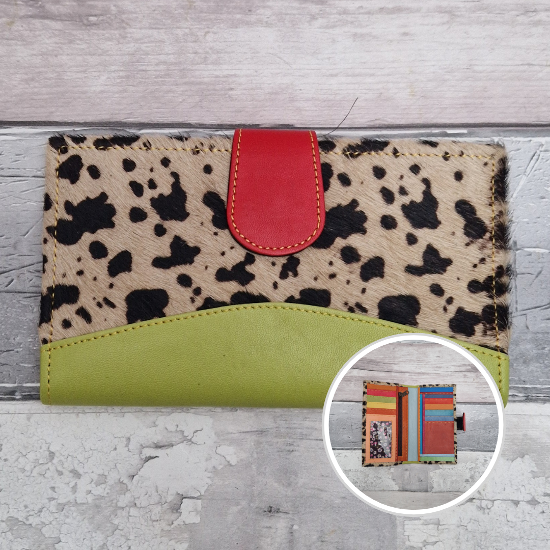 All leather wallet style purse made from multi-coloured pieces with a lime green front panel and textured cow print cover.