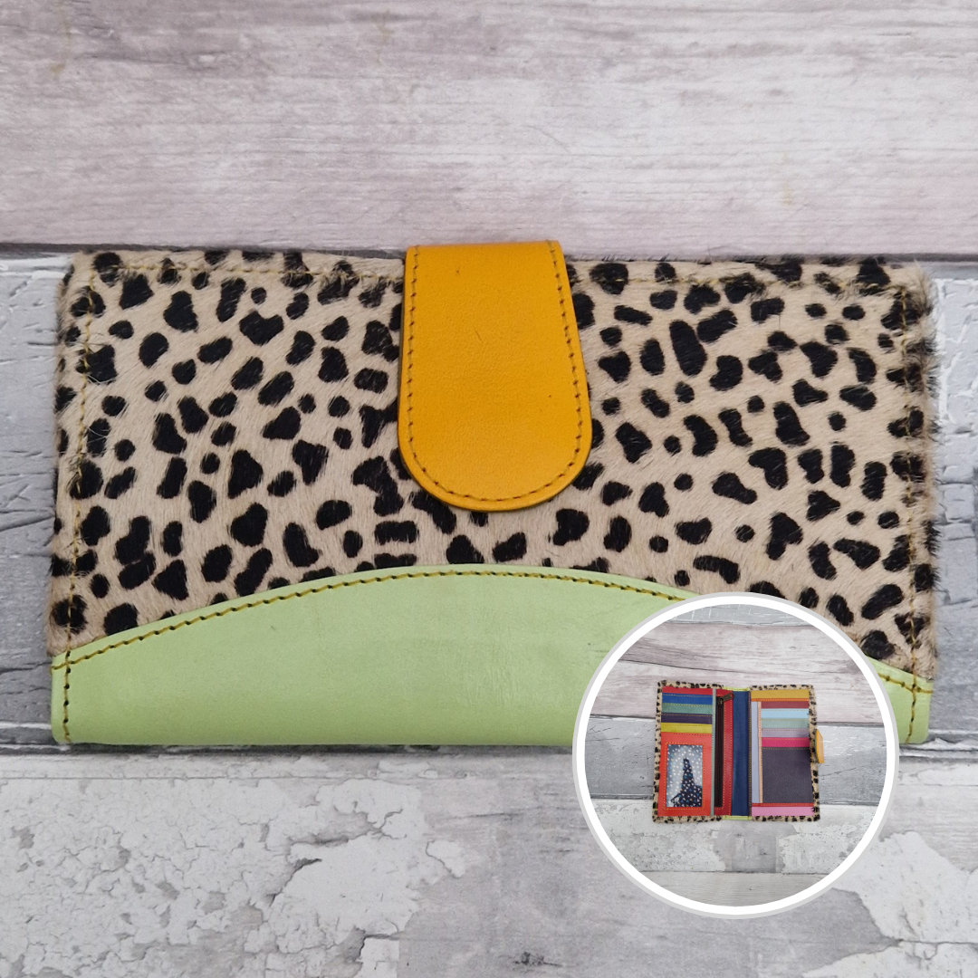 All leather wallet style purse made from multi-coloured pieces with a lime green front panel and textured lynx print cover.