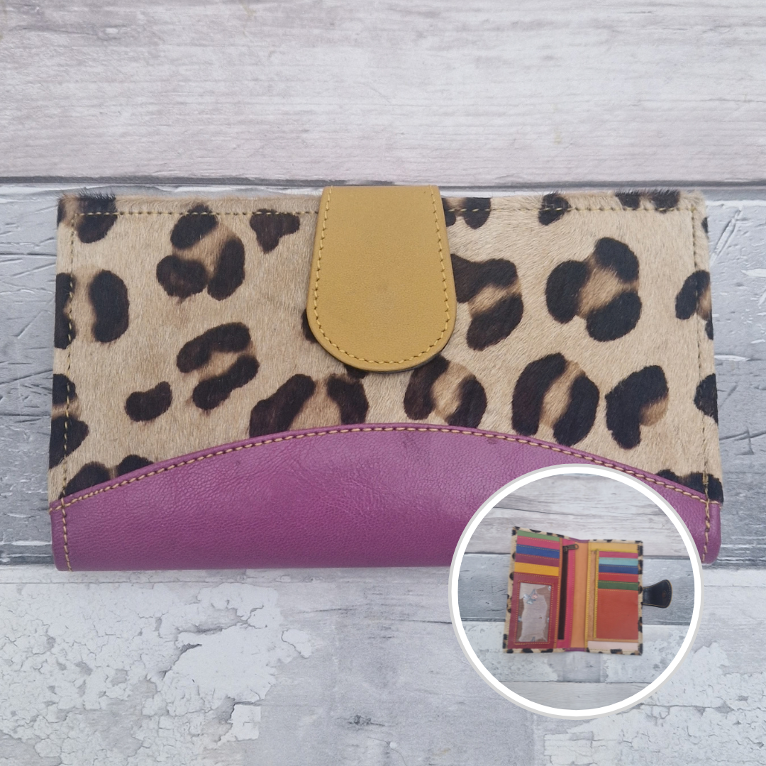 All leather wallet style purse made from multi-coloured pieces with a purple front panel and textured leopard print cover.