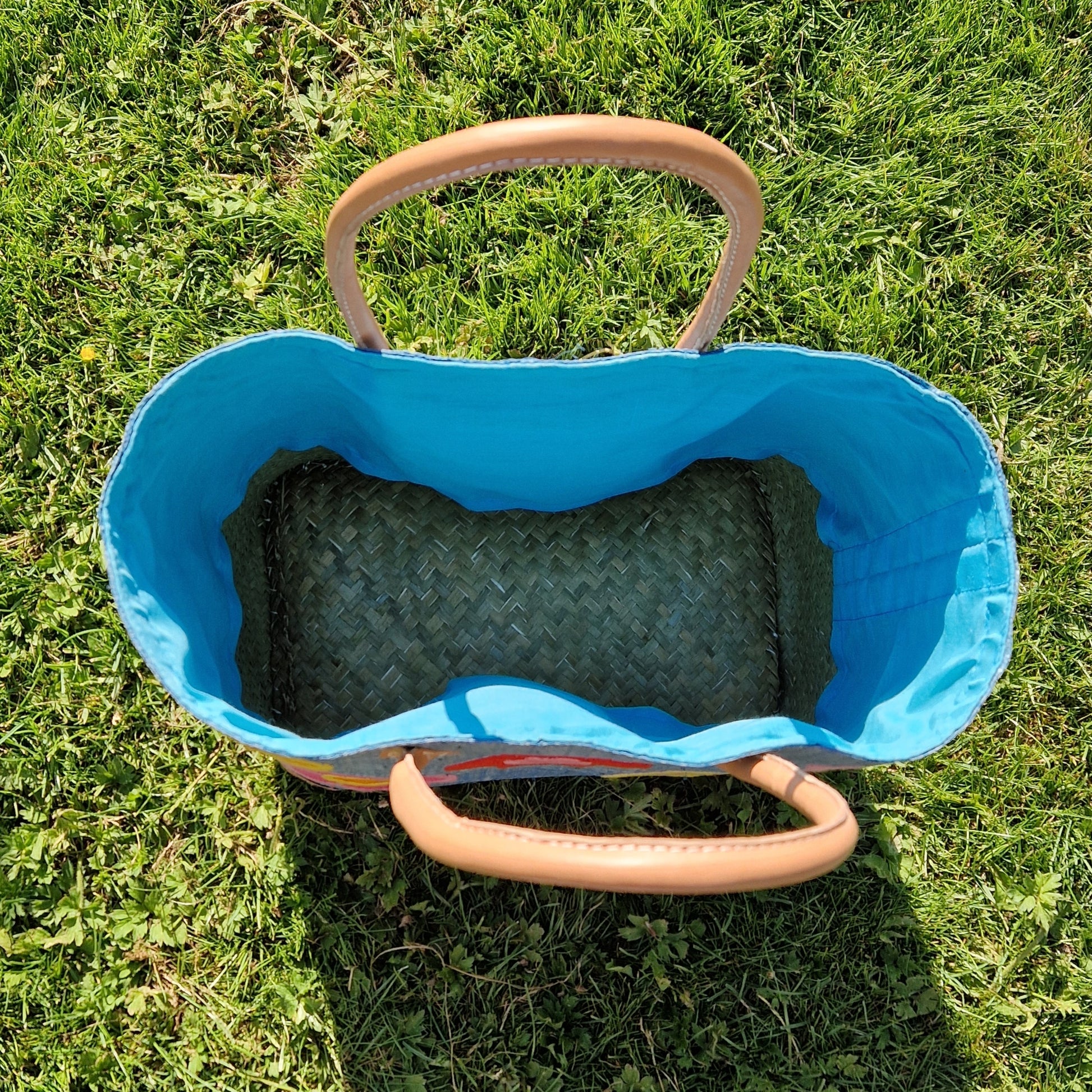 View inside teal blue raffia basket.