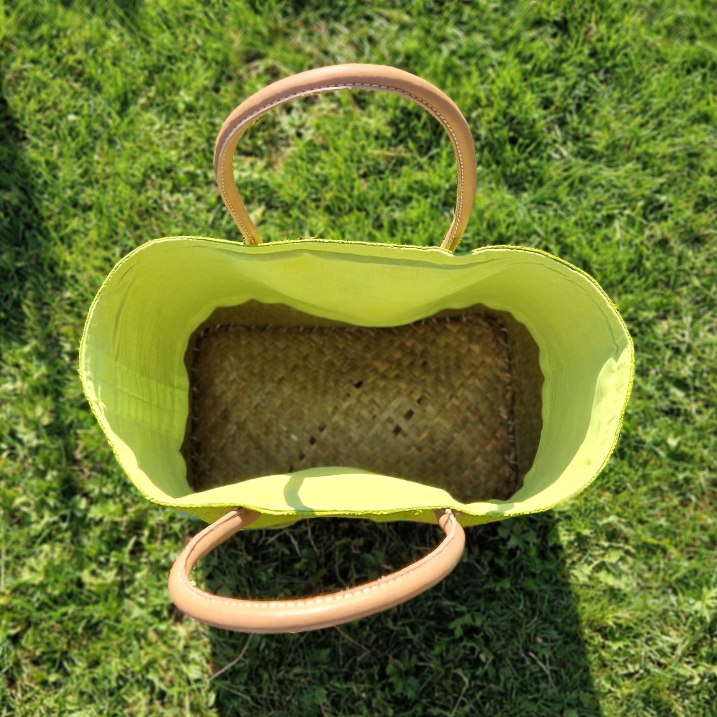 View inside a lime green raffia basket.