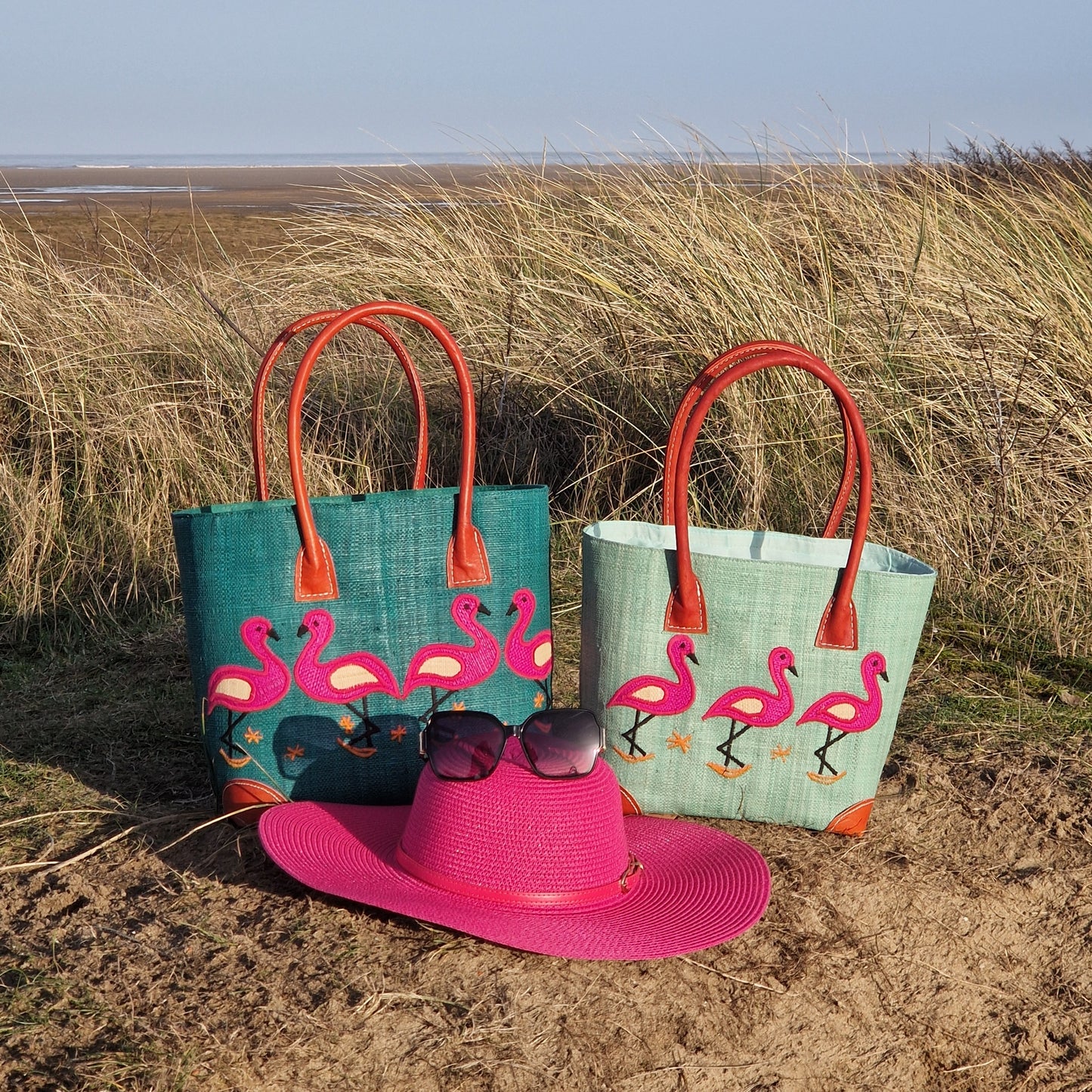 2 Raffia baskets decorated with Pink Flamingos.