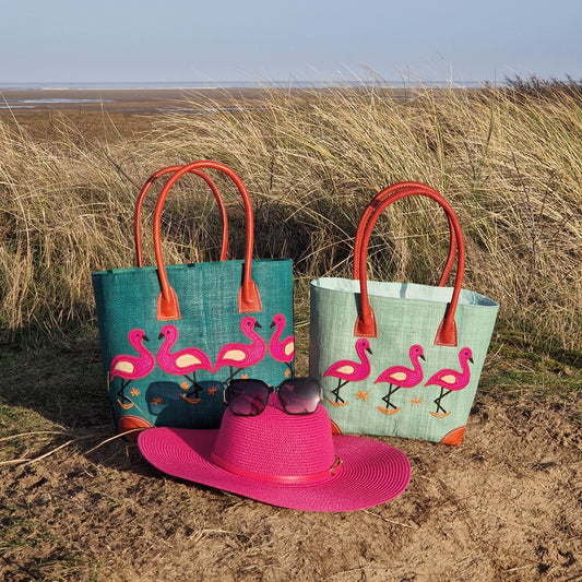 2 Raffia baskets decorated with Pink Flamingos.