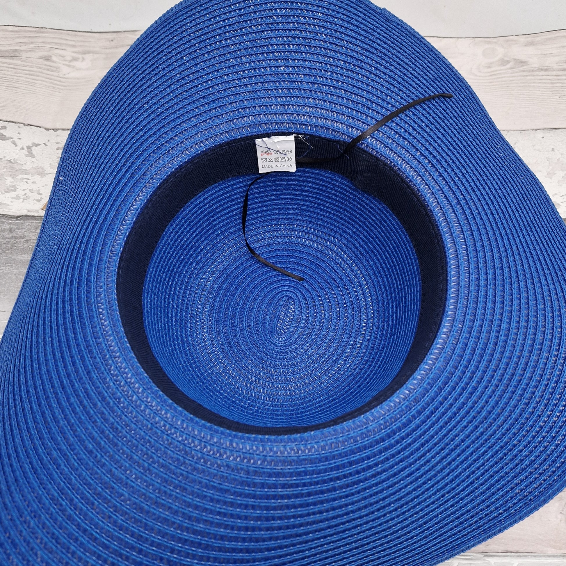 Royal Blue wide brimmed fat with matching coloured belted band.